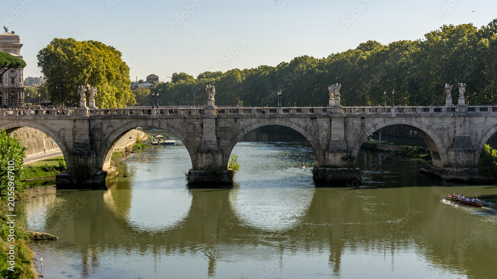 Bridge over the River Tiber at sunset in Rome, Italy