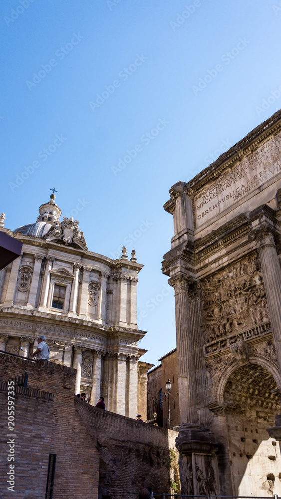 Arch of Septimius Severus and the Curia Julia in the Roman Forum, Rome, Italy