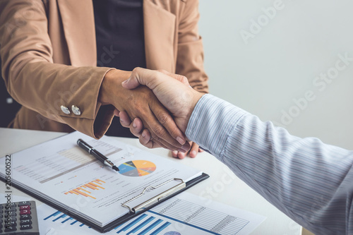 Business partnership meeting concept, Two confident Business handshake and business people after discussing good deal of Trading contract and new projects for both companies, success, partnership