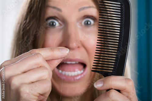 Shocked Woman Losing Hair