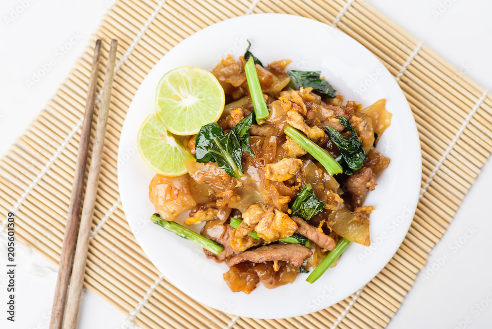 Thai food, stir fried rice noodles in soy sauce (Pad See Ew) Thai food, stir fried rice noodles in soy sauce (Pad See Ew)