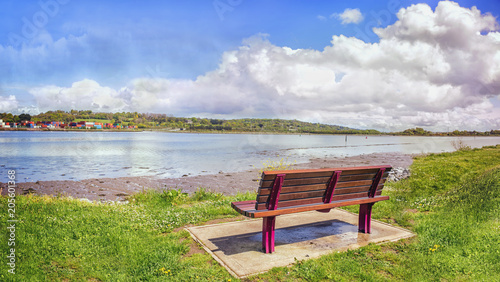 A lonely bench in a quay near Black Rock Castle