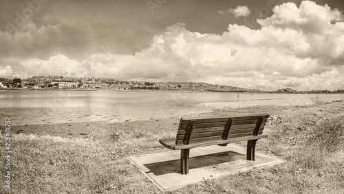 A lonely bench in a quay near Black Rock Castle