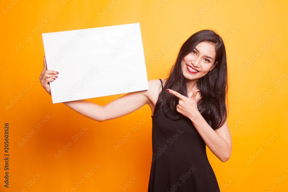 Young Asian woman show thumbs up with white blank sign. Young Asian woman show thumbs up with white blank sign.