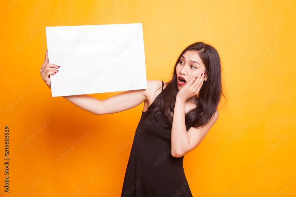 Young Asian woman with white blank sign. Young Asian woman with white blank sign.
