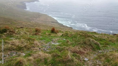 The Fogher Cliffs at the Atlantic Ocean on the Irish west coast photo