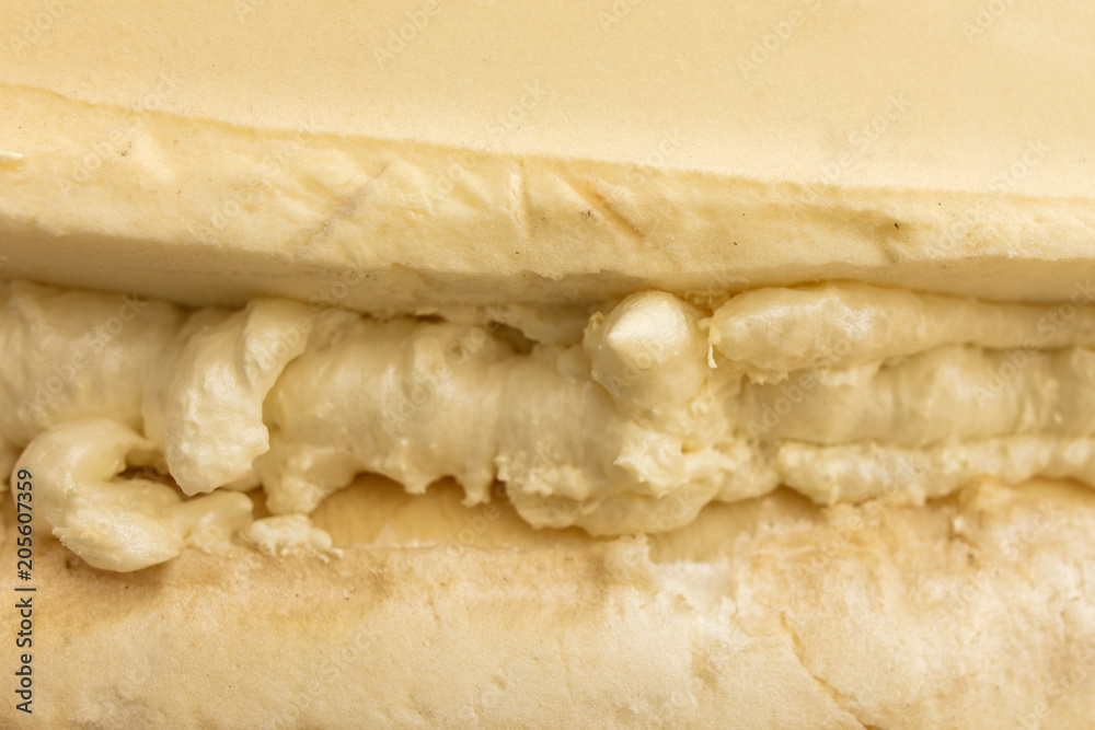 Fototapeta premium Construction foam in the cracks of the wall at the construction site