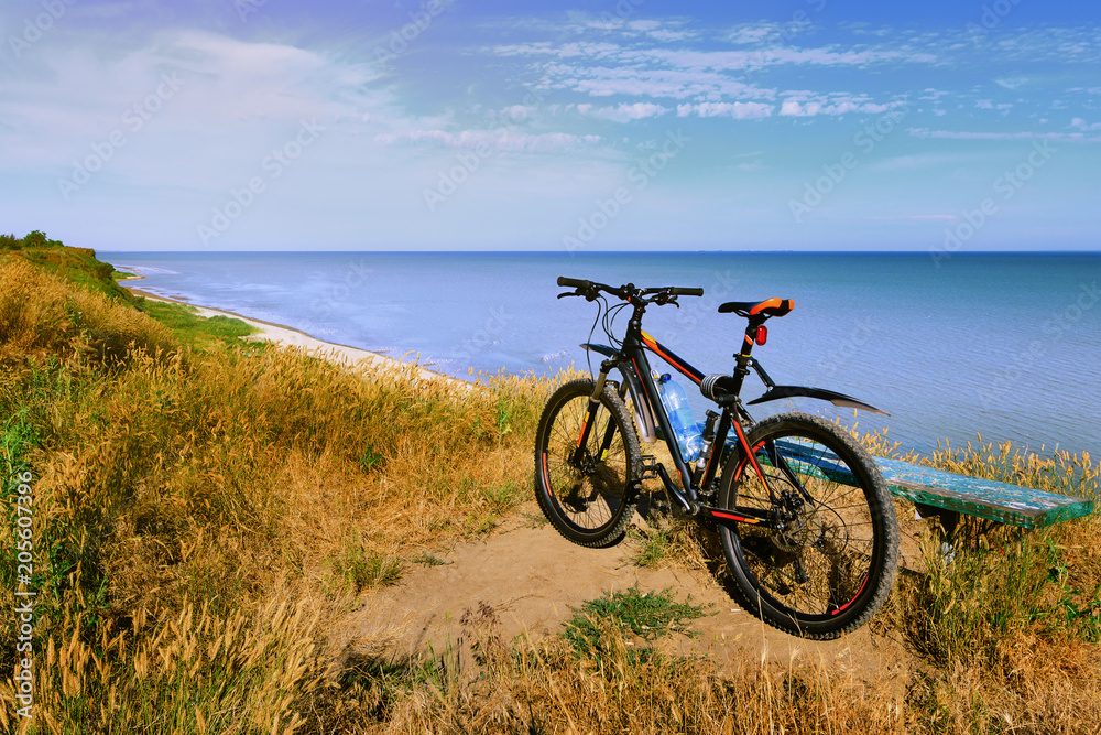Fototapeta premium Mountain bicycle by the sea. Russia, Azov Sea, Taganrog Bay