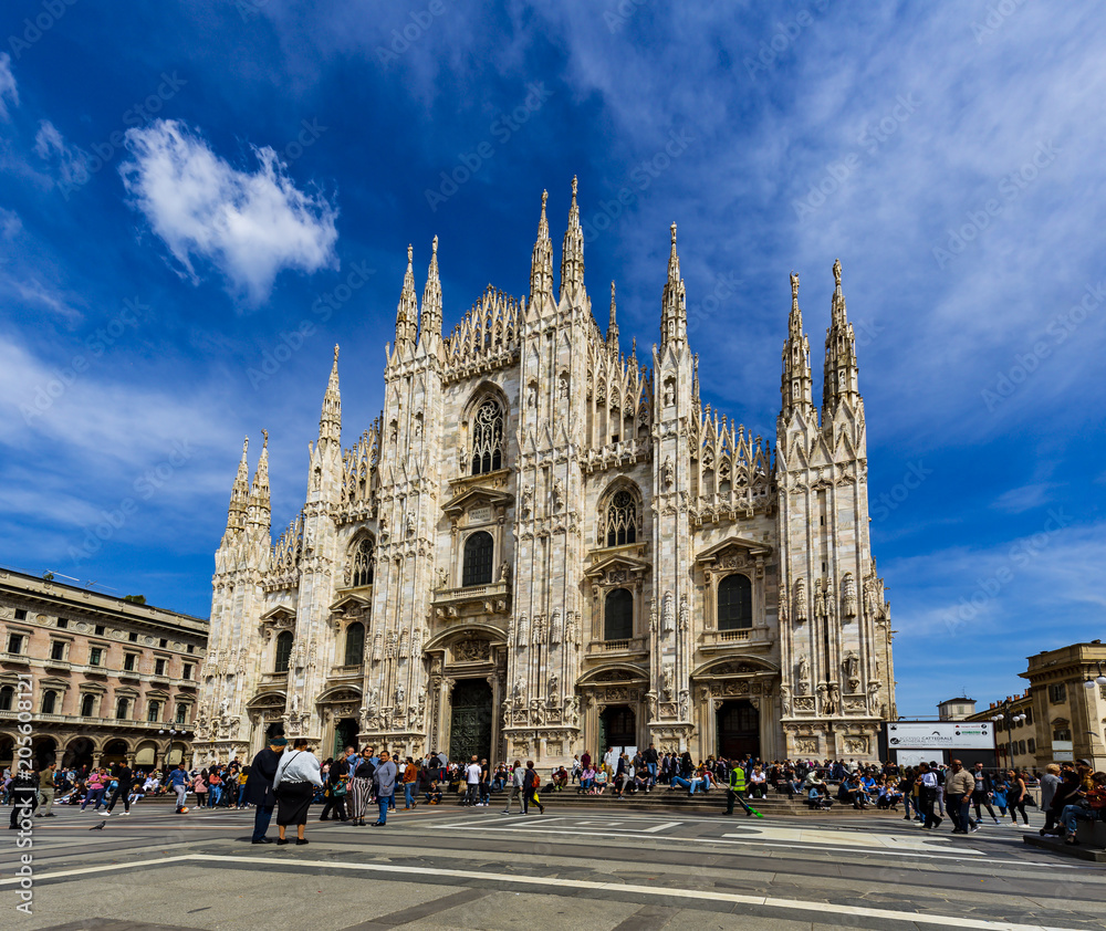 Tourists are relaxing in fornt of Duomo Italy with blue sky and cloud