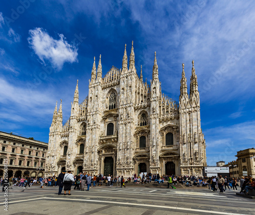 Tourists are relaxing in fornt of Duomo Italy with blue sky and cloud