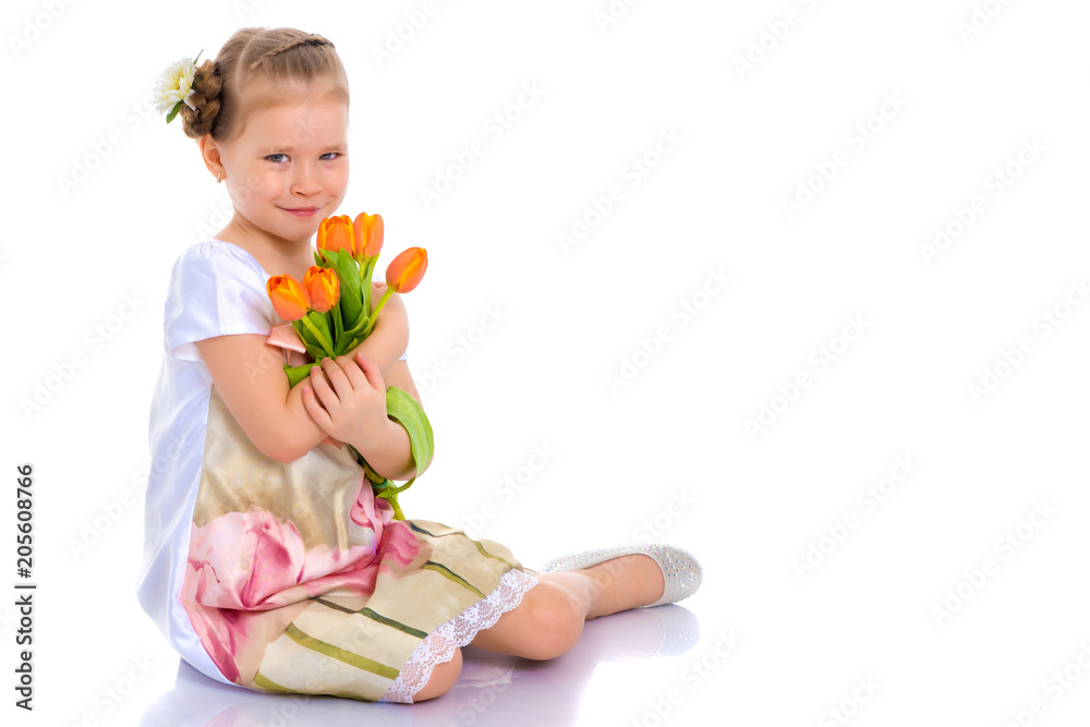 Little girl with a bouquet of flowers