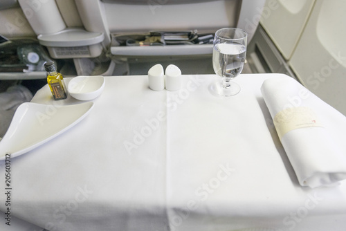 Set inflight meal before setting a white table photo