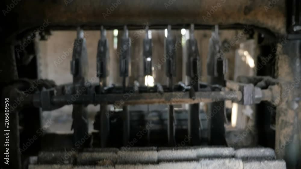 Inside view of sawmill machine for cutting wooden boards with rolling metal rollers and set saws
Inside view of sawmill machine for cutting wooden boards with rolling metal rollers and set saws