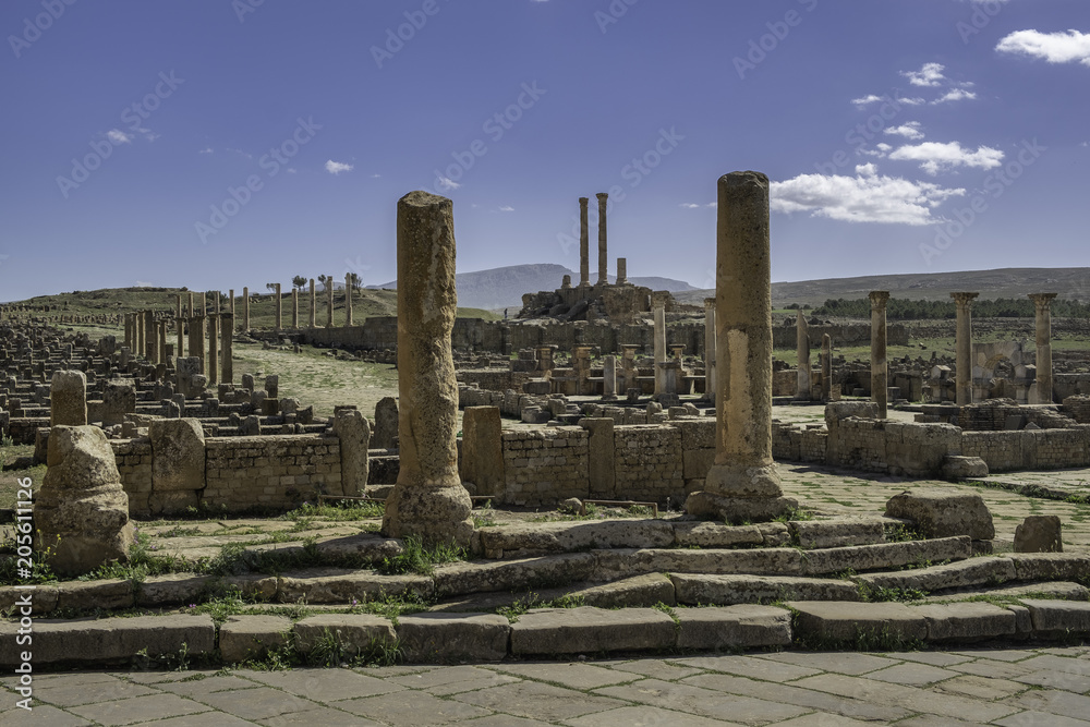 Ruins of roman town Timgad (Colonia Marciana Ulpia Traiana Thamugadi) with the Capitoline Temple in background, Algeria