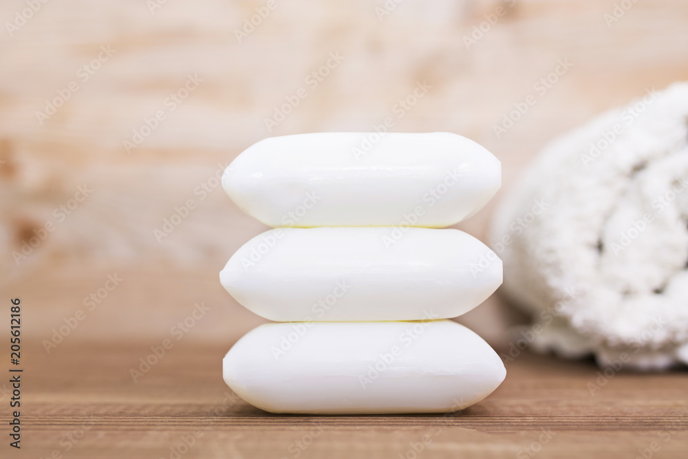 soaps and towels on wood. spa concept soaps and towels on wood. spa concept