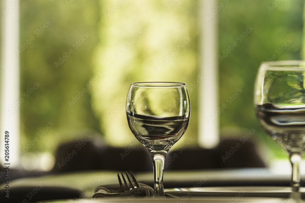 Empty glass standing on the table in the restaurant. Empty glass standing on the table in the restaurant.