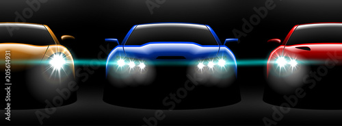 realistic red yellow blue three sport car view with unlocked headlights in the dark