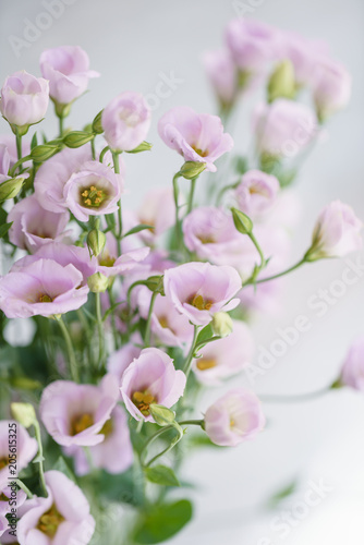 bunch of lilac eustoma flowers in glass vase. Love Vintage background with flowers. Wallpapers for phone