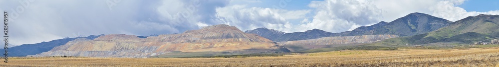 Panorama of Oquirrh Mountain range which includes The Bingham Canyon Mine or Kennecott Copper Mine, rumored the largest open pit copper mine in the world in Salt Lake Valley, Utah. USA.