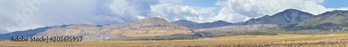 Panorama of Oquirrh Mountain range which includes The Bingham Canyon Mine or Kennecott Copper Mine, rumored the largest open pit copper mine in the world in Salt Lake Valley, Utah. USA.