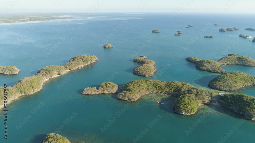 Aerial view of Small islands with beaches and lagoons in Hundred Islands National Park, Pangasinan, Philippines. Famous tourist attraction, Alaminos.