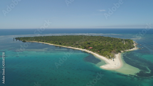 Tropical island with white sandy beach. Aerial view: Magalawa island with colorful reef. Seascape, ocean and beautiful beach paradise. Philippines,Luzon. Travel concept.