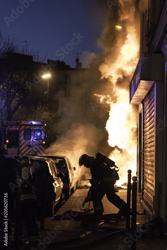 Sticker Fire brigade at violently burning apartment building in Paris France seen from s