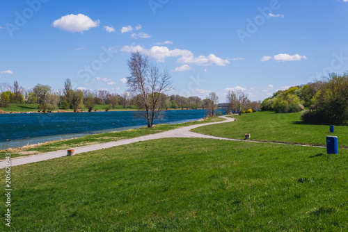 Paths on a Danube Island, view with Danube River in Vienna city, capital of Austria
