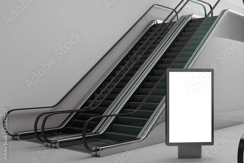 Silver escalator with empty banner