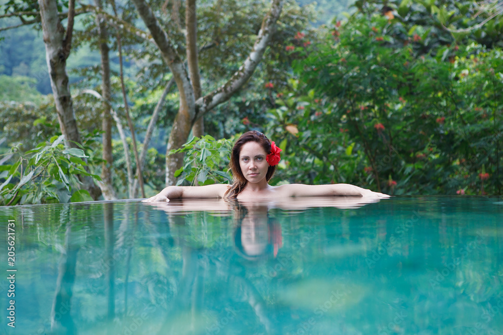 girl in the tropic jungle pool
