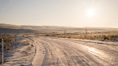 Russia Winter Landscape. Road  Hills And Fields At Sunset.