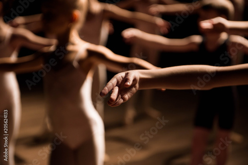 A large group of children rehearsing and dancing the ballet