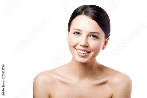 Beauty portrait of a beautiful young woman with perfect clean skin. Smile and good mood