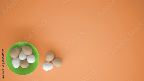 Chicken eggs into a green cup on the table, orange background with copy space, breakfast easter food concept idea, top view