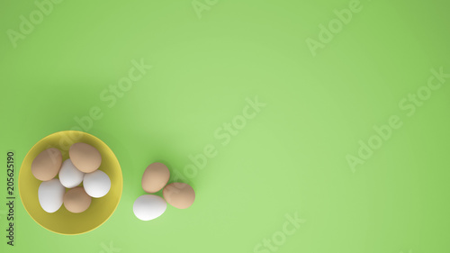Chicken eggs into a yellow cup on the table  green background with copy space  breakfast easter food concept idea  top view
