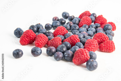 Blueberries and Raspberries on white background