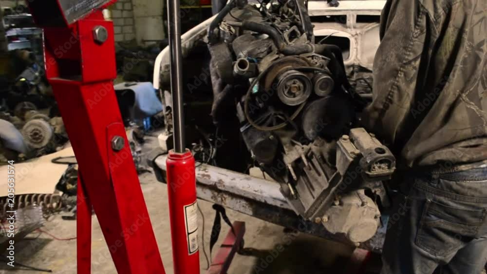 disassemble the motor from the car