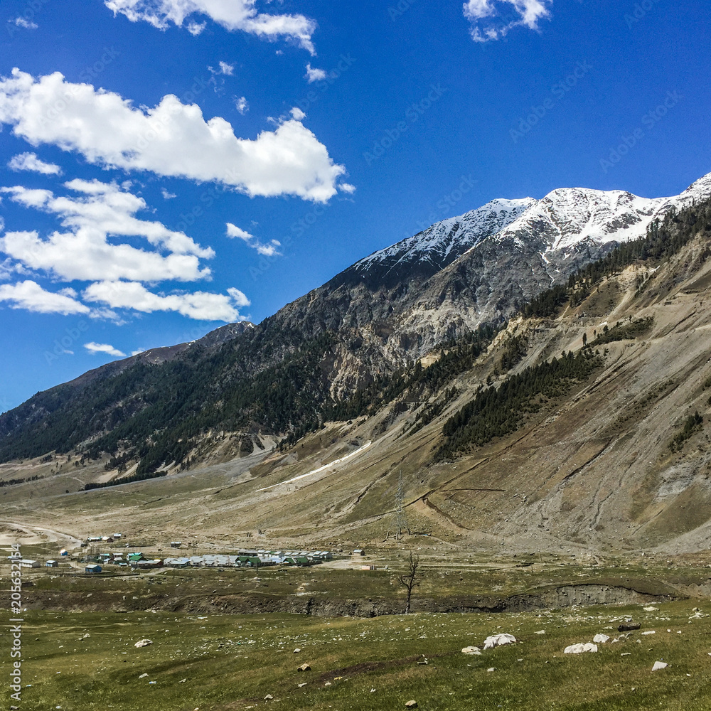 mountain on blue sky with clouds background in Kashmir , India