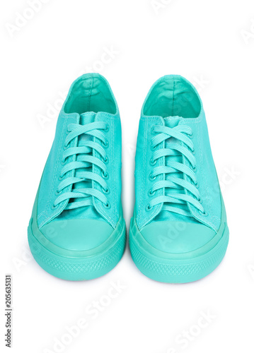 Turquoise rubber sneakers, casual footwear isolated on white background