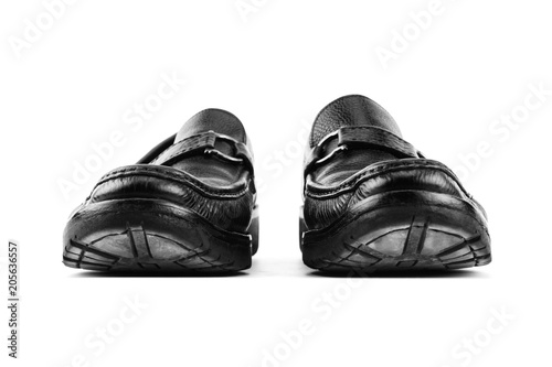 Black leather shoes isolated on white background with copy space. © ningkub