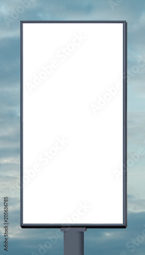 Blank vertical billboard against a blue sky. photo