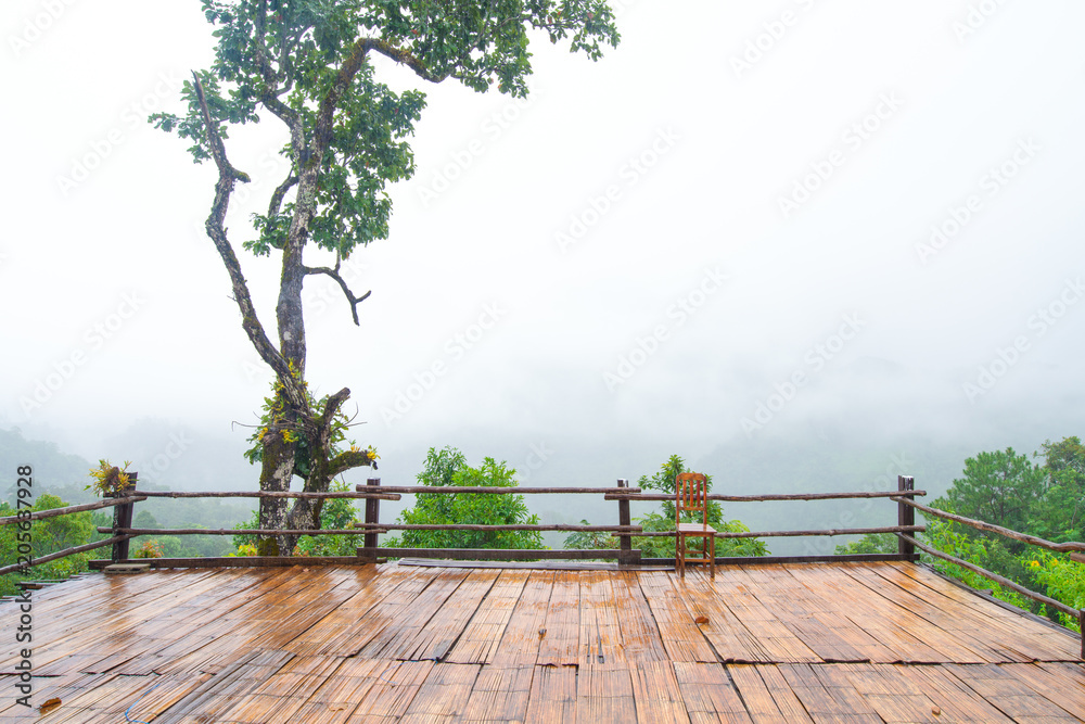 Patio and chair wood Mountain View in Asia, Doi Luang Chiang Dao Chiang Mai Thailand After rain, there is a fog float, covered with green forest, mountain air fresh air landscape nature concept Patio and chair wood Mountain View in Asia, Doi Luang Chiang Dao Chiang Mai Thailand After rain, there is a fog float, covered with green forest, mountain air fresh air landscape nature concept