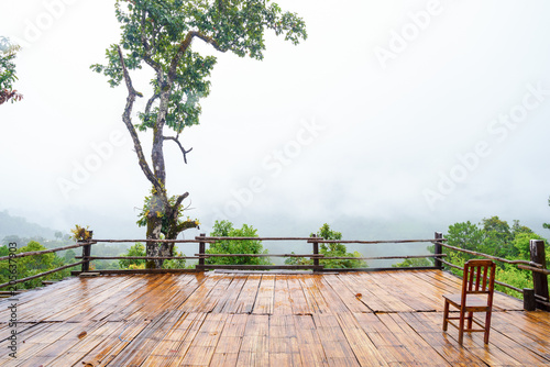 Patio and chair wood Mountain View in Asia  Doi Luang Chiang Dao Chiang Mai Thailand After rain  there is a fog float  covered with green forest  mountain air fresh air landscape nature concept