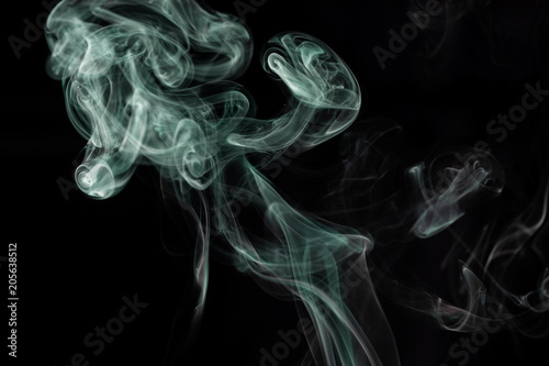 Fototapeta Naklejka Na Ścianę i Meble -  Make smoke from incense.  Black background