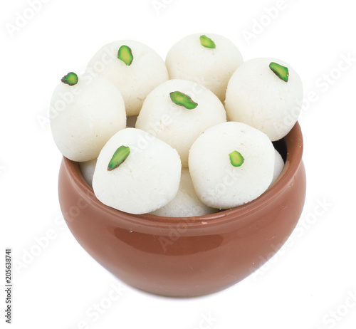 Indian Sweet Rasgulla Also Know as Rosogolla, Roshogolla, Rasagola, Ras Gulla, Anguri Rasgulla or Angoori Rasgulla is a Syrupy Dessert Popular in India. It is Made From Ball Shaped Dumplings. photo