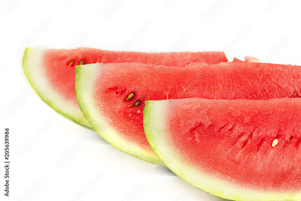 Sliced ripe watermelon on white background. Closeup of watermelon Sliced ripe watermelon on white background. Closeup of watermelon