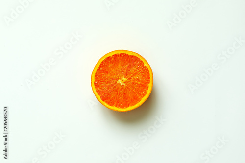 Orange fruit. Orange half fruit sliced isolate on white background seen from above flatlay style  close up.