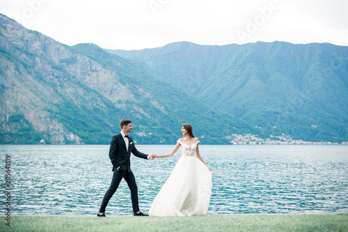 wedding couple the background of the lake and mountains