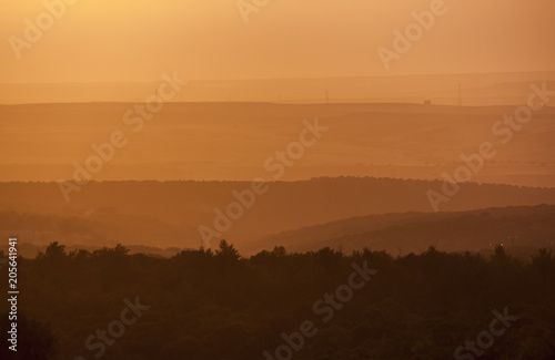 Beautiful sunset with electric tower. Orange and yellow abstract background