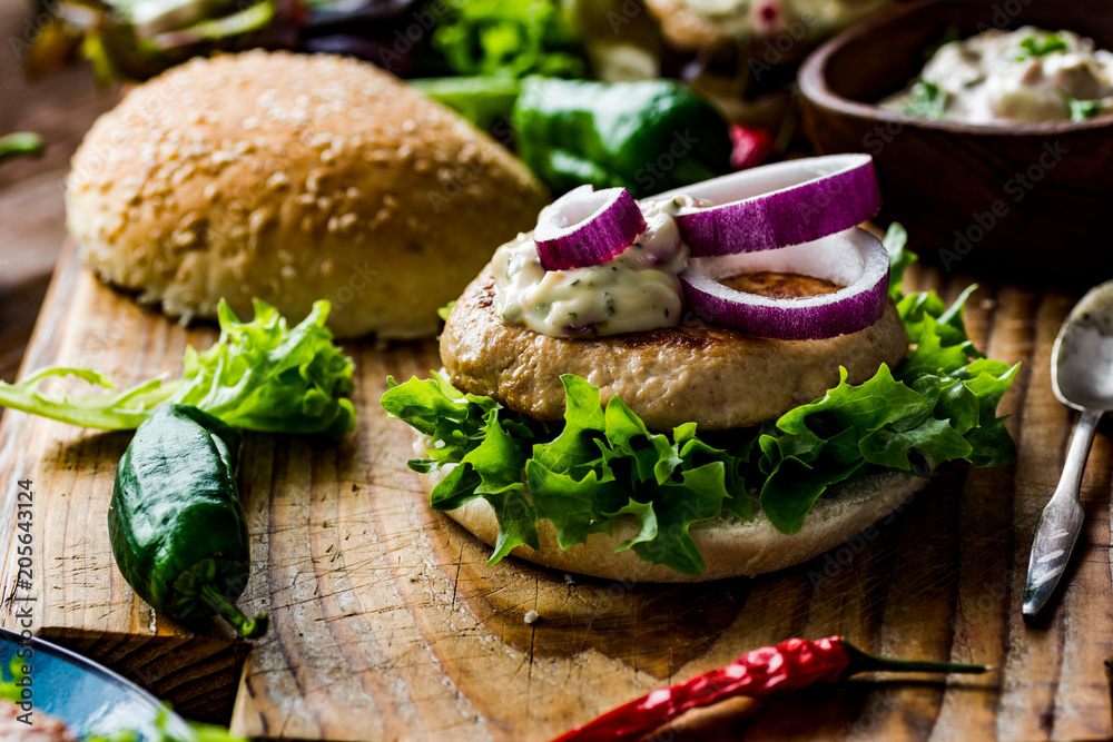 Chicken burgers with fresh salad, onion, peppers and mayonnaise sauce